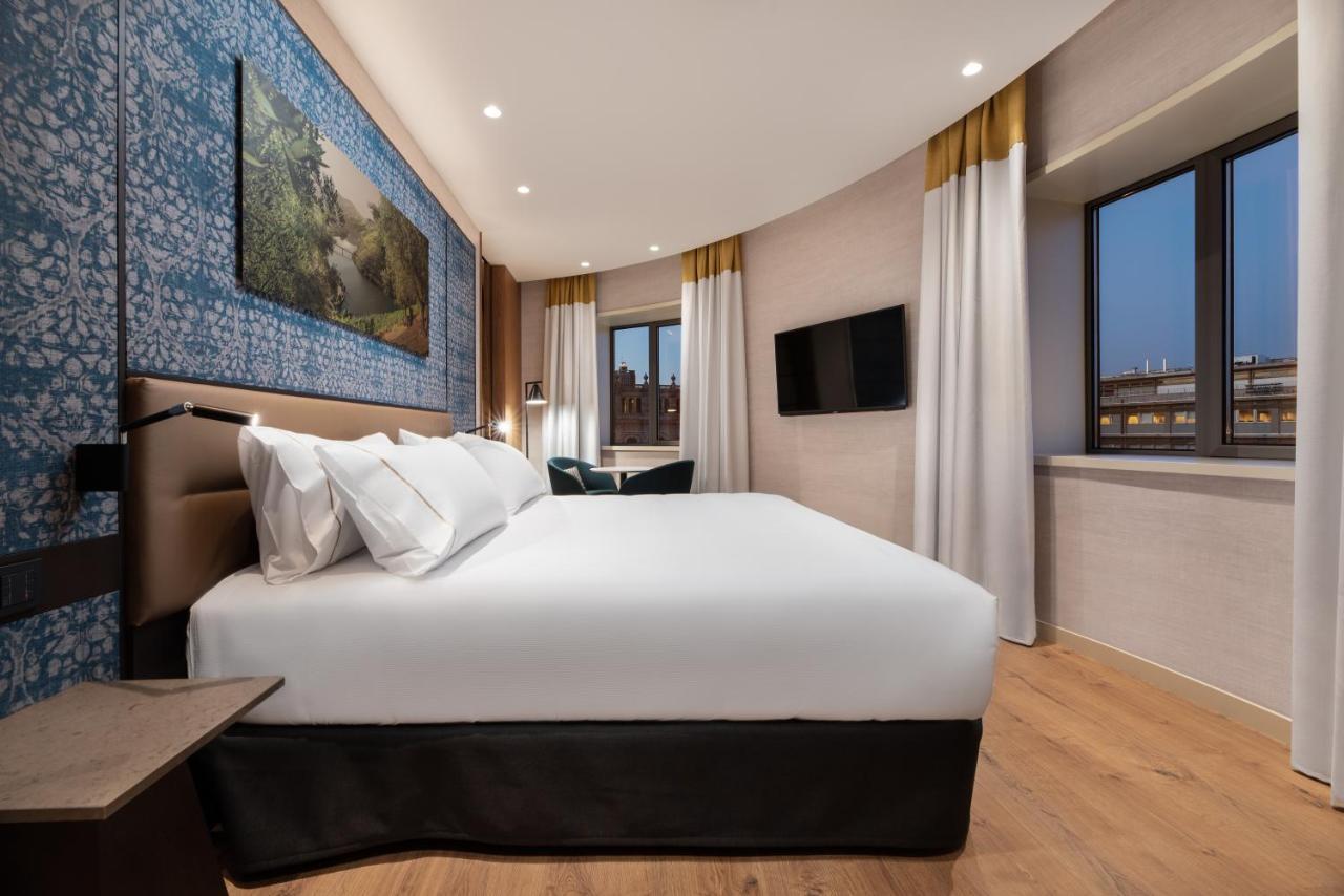 Hotel Eurostars Aliados Porto Exterior foto A bedroom at the hotel
